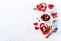 Romantic breakfast with chia, granola, yogurt and berries on old white concrete background. Health and diet concept. Royalty Free Stock Photo