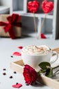 Breakfast coffee love heart red rose setting with white mug and gift box in Valentine`s day setting