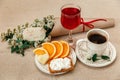 Romantic Breakfast.Cup of Coffee,Cut Orange,Biscuit with Cottage Cheese.Glass of Red Drink.Wish Card with Flowers Royalty Free Stock Photo