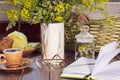 Romantic breakfast with fresh tea rye bread cheese and herbs, wild flowers on terrace of cottage Royalty Free Stock Photo