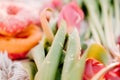 Romantic breakfast on the sandy beach. Photo session on a blanket with tulips and a book, donuts and champagne . Royalty Free Stock Photo