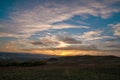 Romantic, bright and colorful sunset over a mountain range in Transilvania Royalty Free Stock Photo