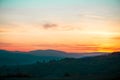 Romantic, bright and colorful sunset over a mountain range in Transilvania Royalty Free Stock Photo