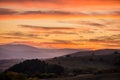 Romantic, bright and colorful sunset over a mountain range in Transilvania Royalty Free Stock Photo