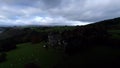 Romantic castle Chateau de Froidcour. Drone aerial view flying forwards, dark atmosphere