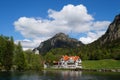 romantic Neuschwanstein castle and restaurant Zur Alpenrose in the Alps (Bavaria, Germany) Royalty Free Stock Photo