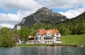 romantic Neuschwanstein castle and restaurant Zur Alpenrose in the Alps (Bavaria, Germany) Royalty Free Stock Photo