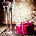 Romantic champagne with a red gift