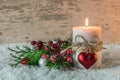 Romantic Christmas or Advent decoration with candle, heart and snow Royalty Free Stock Photo