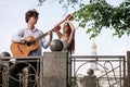 Romantic city date couple guitar music concept