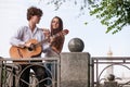 Romantic city date couple guitar music concept