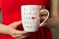 Woman in red dress holding coffee mug, I love You, Valentines day cup Royalty Free Stock Photo