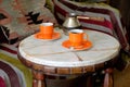 Romantic coffee table, two cups of coffee on a marble table.