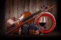 Composition with red grape, wine, violin and barrel Royalty Free Stock Photo