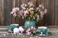 Spring flowers background with tea cup and sweet cookies Royalty Free Stock Photo
