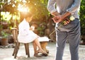 Romantic concept with man holding white rose and ring making marriage