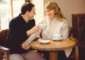 Romantic concept with man and woman at cafe Royalty Free Stock Photo