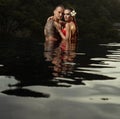 Romantic couple alone in infinity swimming pool