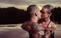 Romantic couple alone in infinity swimming pool