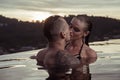 Romantic couple alone in infinity swimming pool