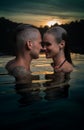 Romantic couple alone in infinity swimming pool