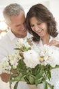 Romantic Couple Arranging Flowers