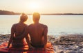 Romantic couple on the beach at colorful sunset on background Royalty Free Stock Photo