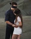 Romantic couple blindfolded with black ribbon. Love blind concept Royalty Free Stock Photo