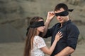 Romantic couple blindfolded with black ribbon. Love blind concept Royalty Free Stock Photo
