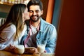 Romantic couple in cafe is drinking coffee and enjoying being together Royalty Free Stock Photo