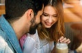 Romantic couple in cafe is drinking coffee and enjoying being together Royalty Free Stock Photo