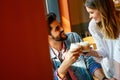 Romantic couple in cafe is drinking coffee and enjoying being together Royalty Free Stock Photo