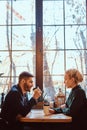 Romantic couple in the cafe is drinking coffee and talking. Royalty Free Stock Photo