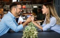 Romantic couple in cafe having date and enjoying being together. Royalty Free Stock Photo