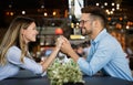 Romantic couple in cafe having date and enjoying being together. Royalty Free Stock Photo