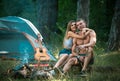 Romantic couple on camping. Outdoor adventure with friends on nature. Sexy coupl travel holidays on nature. Royalty Free Stock Photo