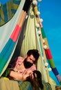 Romantic couple camping on spring landscape. Adventure for young lovers campers in tent on nature. Hipster couple tender Royalty Free Stock Photo