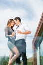 Romantic couple with champagne at balcony in resort Royalty Free Stock Photo