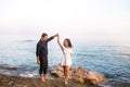 Romantic couple dancing ans smiling at sunset. Royalty Free Stock Photo