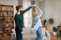 Romantic Couple Dancing Home. Playful Spouses in Casual Clothing Dancing Royalty Free Stock Photo