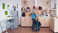 Romantic couple dancing in kitchen