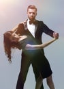 Portrait Of Young Couple Dancing Over Grey Background Royalty Free Stock Photo