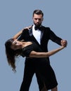 Portrait Of Young Couple Dancing Over Grey Background Royalty Free Stock Photo