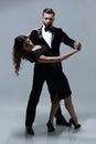 Portrait Of Young Couple Dancing Over Grey Background Royalty Free Stock Photo