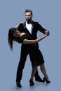 Portrait Of Young Couple Dancing Over Grey Background Royalty Free Stock Photo