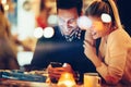 Romantic couple dating in pub at night Royalty Free Stock Photo