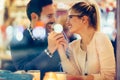 Romantic couple dating in pub at night Royalty Free Stock Photo