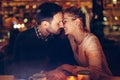 Romantic couple dating in pub at night Royalty Free Stock Photo