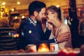 Romantic couple dating in pub at night Royalty Free Stock Photo