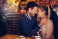 Romantic couple dating in pub at night Royalty Free Stock Photo